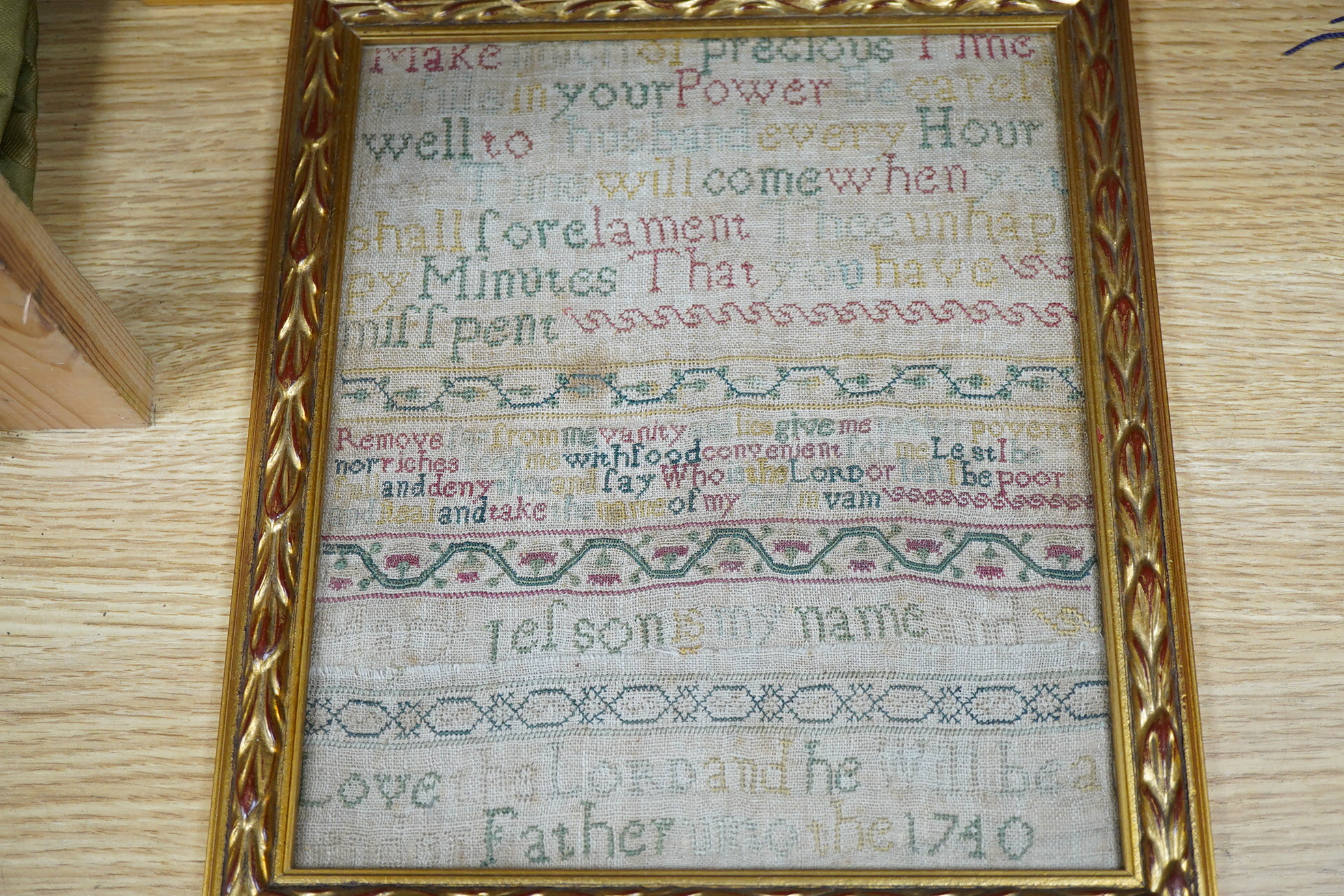 Three framed and glazed samplers, including a 1740 banded sampler by Mary Jelson, 20.5cm x 24cm, embroidered with three various verses, together with a later, smaller, alphabet sampler dated 1760, 15cm x 14cm and another